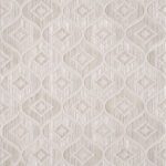 Intricate geometric pattern on textured white surface.