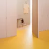 Empty fitting room with yellow floor tiles