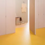 Empty fitting room with yellow floor tiles