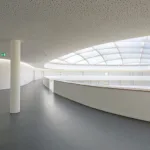 Modern curved hallway with skylight