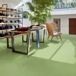 Modern clothing store with green floor