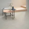 Minimalist room with nested coffee tables.
