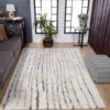 Modern living room with striped area rug.