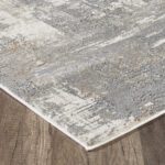 Gray abstract area rug on wooden floor