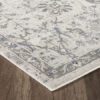 Gray floral area rug on wooden floor