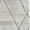 Close-up of a white textured rug.