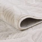 Close-up of rolled beige carpet