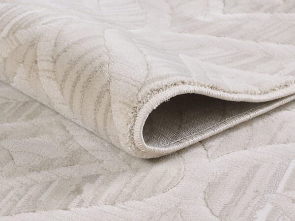 Close-up of rolled beige carpet