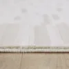 Close-up of beige carpet on wooden floor