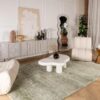 Modern living room with abstract decor and furniture.