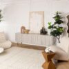 Modern living room with abstract art and plants