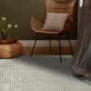 Cozy corner with chair, cushion, and vase