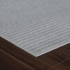 Gray striped carpet on hardwood floor
