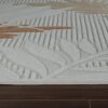 Textured carpet with leaf patterns on floor