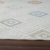 Geometric patterned rug with colorful diamond shapes.