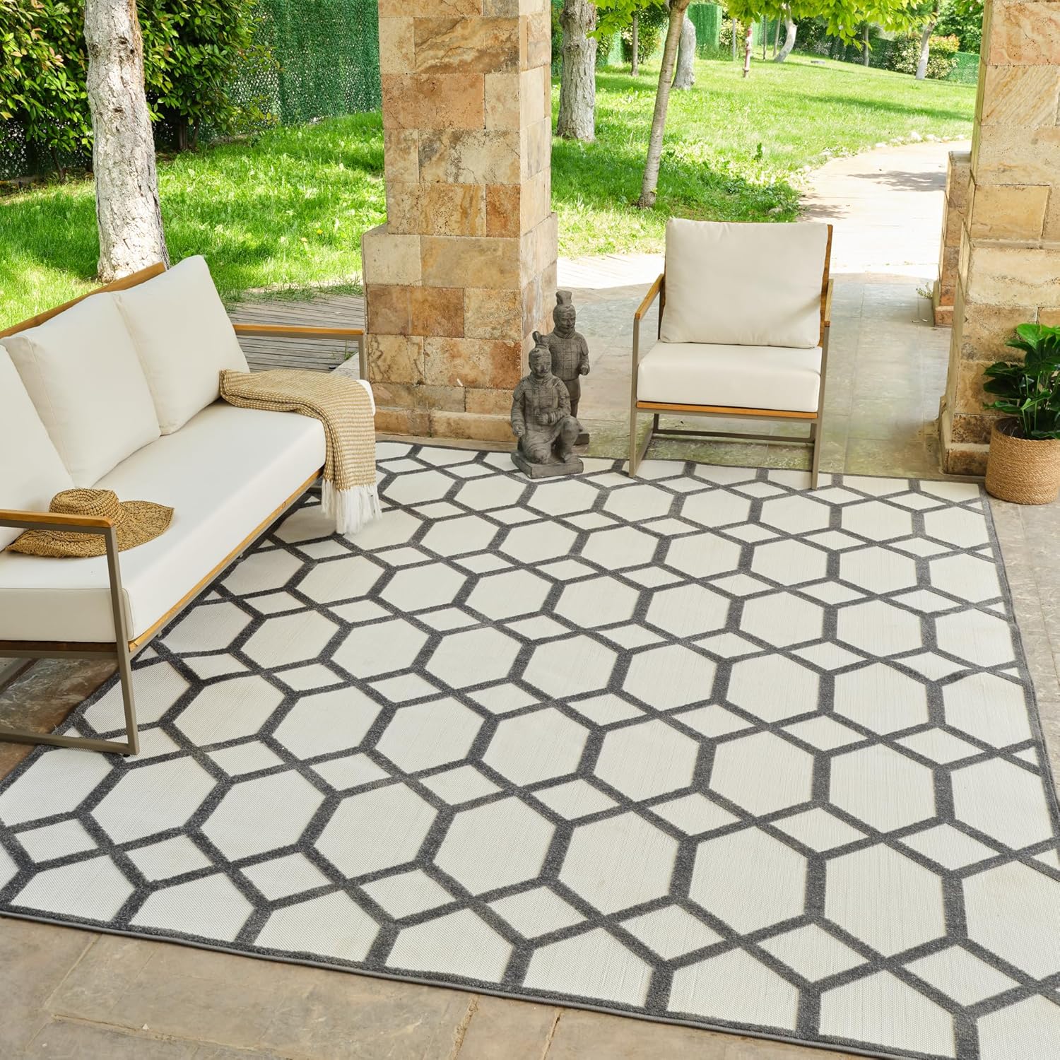 Outdoor patio with geometric patterned rug.