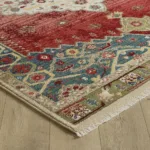 Colorful patterned rug on wooden floor