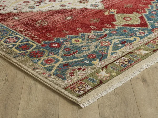 Colorful patterned rug on wooden floor