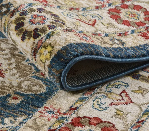 Close-up of rolled colorful patterned rug