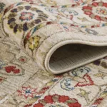 Close-up of rolled floral-patterned rug