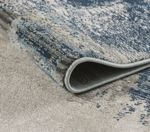 Close-up of a blue patterned rug corner