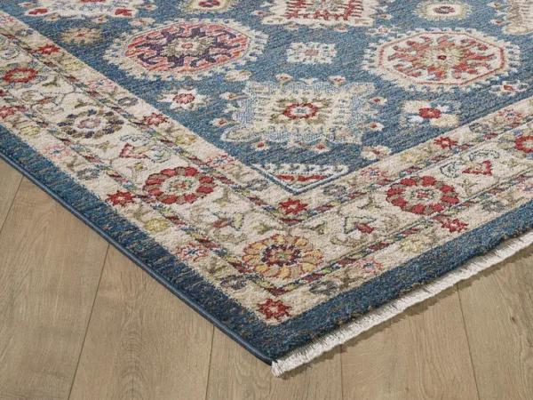 Colorful patterned rug on wooden floor