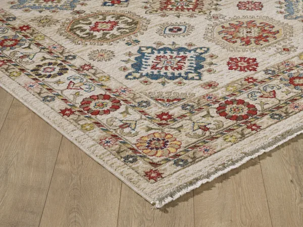 Colorful patterned rug on wooden floor