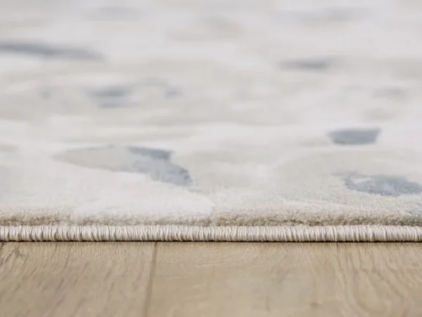 Close-up of a rug on wooden floor