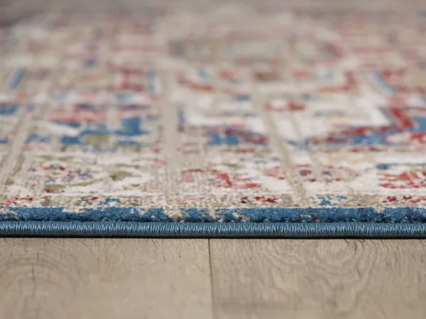 Colorful rug on wooden floor