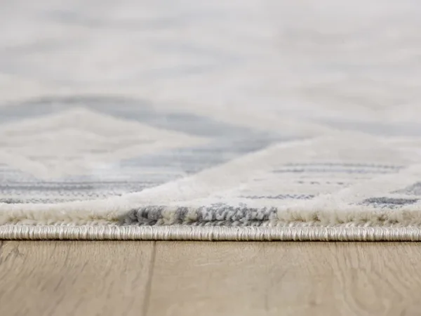 Close-up of rug on wooden floor