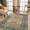 Living room with patterned rug and armchair.