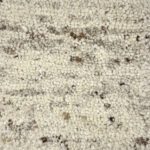 Textured wool rug with natural colors.