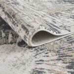 Abstract patterned rug in gray and beige.