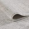 Close-up of gray textured rug with patterns.