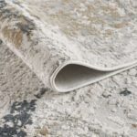 Close-up of textured beige and gray area rug.