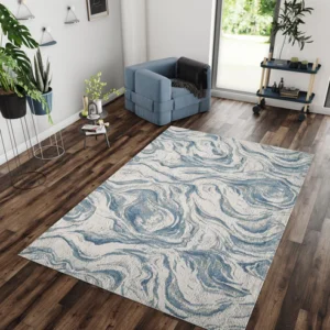 Blue and white swirled rug on wooden floor.