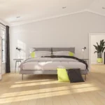 Modern bedroom with gray curtains and wooden flooring.