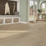 Modern mudroom with wood flooring and plants.