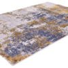 Abstract blue and gold area rug design.