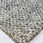 Close-up of woven wool rug texture