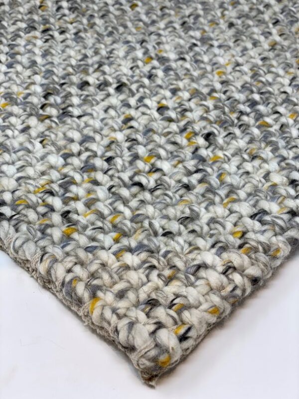 Close-up of woven wool rug texture