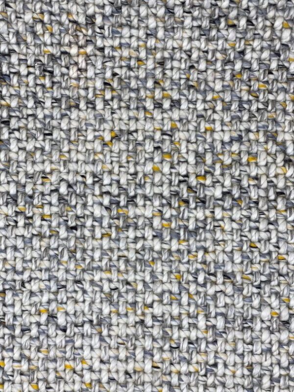 Close-up of textured woven fabric with gray and yellow.