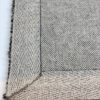 Close-up of patterned woven rug edge