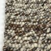 Close-up of textured woven wool rug.