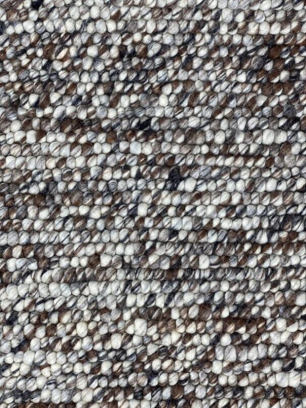 Close-up of textured, mottled brown and white fabric.