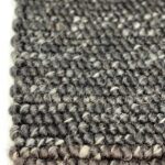 Close-up of gray woven carpet texture