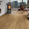Contemporary living room with fireplace and wood flooring.