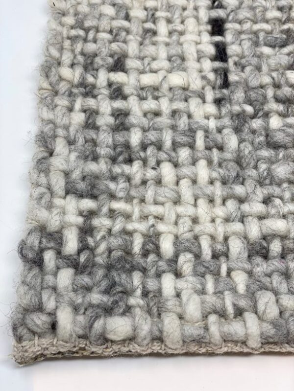 Close-up of gray textured woven fabric.