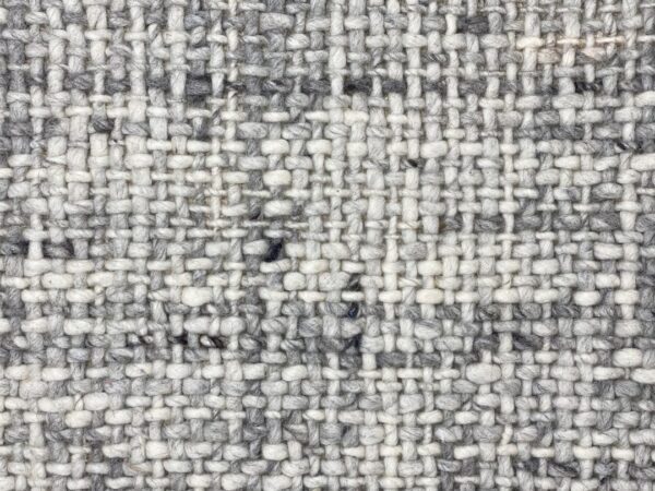 Close-up of gray and white woven fabric texture.