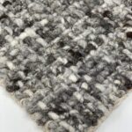 Gray and white woven wool rug texture